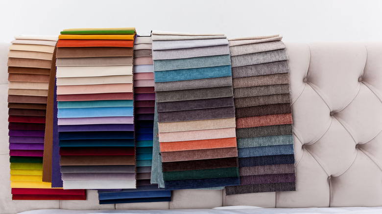 Colorful upholstery swatches on a white headboard
