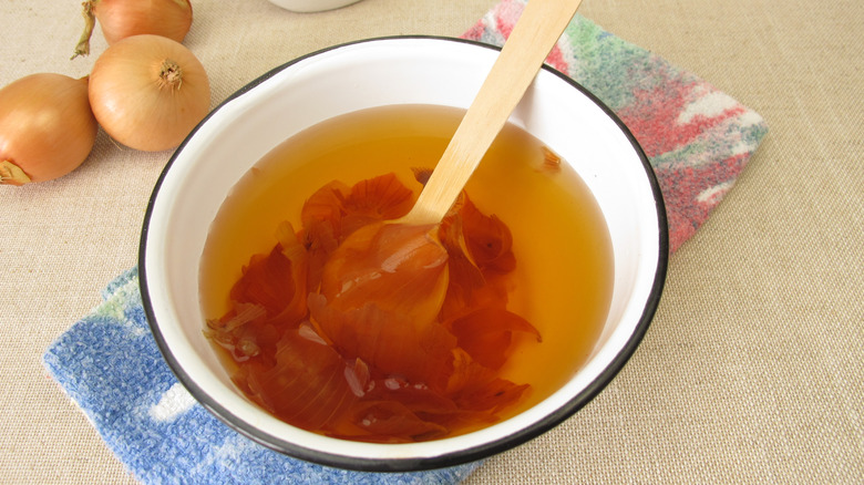 Onion skin soaking in water