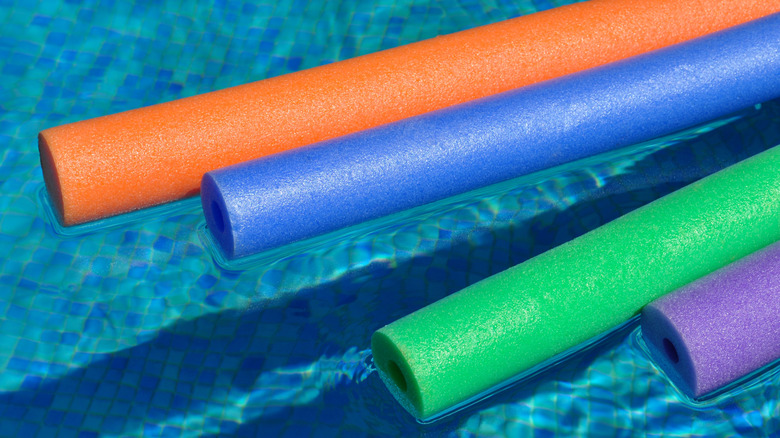 Pool noodles floating in the water
