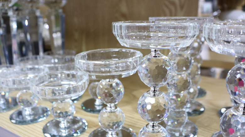 A collection of crystal candle holders
