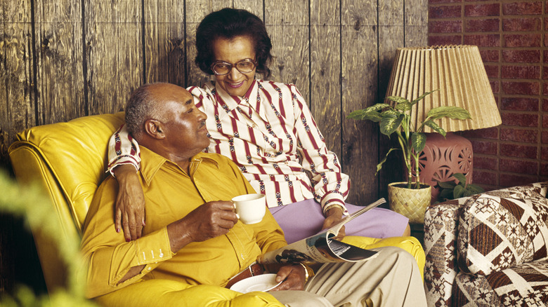 A couple sitting a home designed in the 1980s