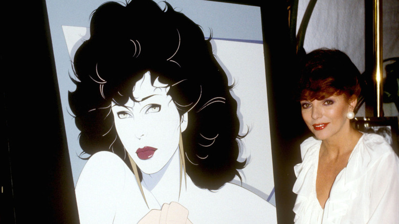 Vintage Patrick Nagel wall art with a woman sitting next to it