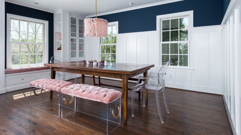 A dining table with acrylic furniture.