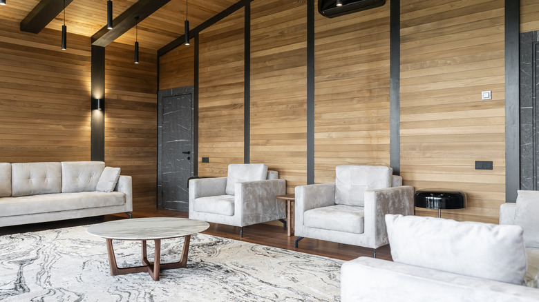 A wood-paneled living room.