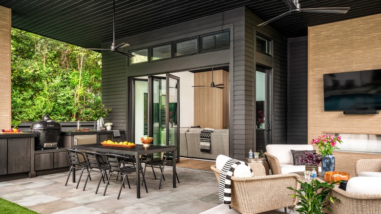 A California room with separate seating, fans, and cooking area