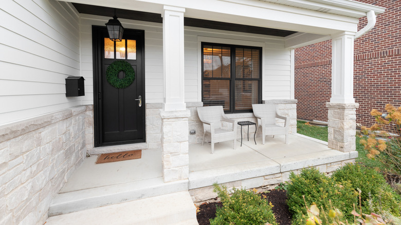 White stone flooring covering a front porch