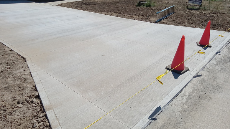 A freshly poured concrete driveway