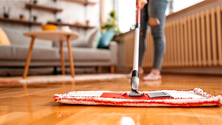 Person cleaning polished floor