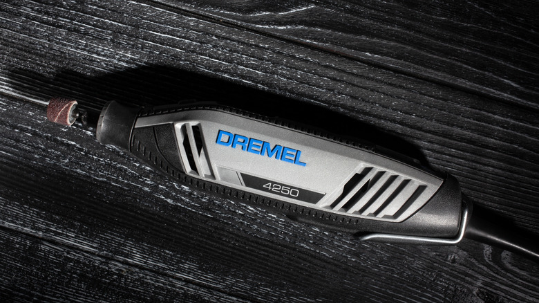 Dremel multitool on black wood
