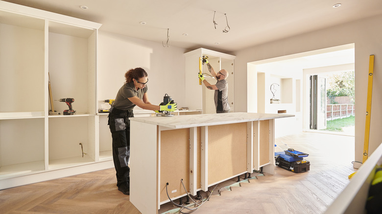 People working on kitchen remodel