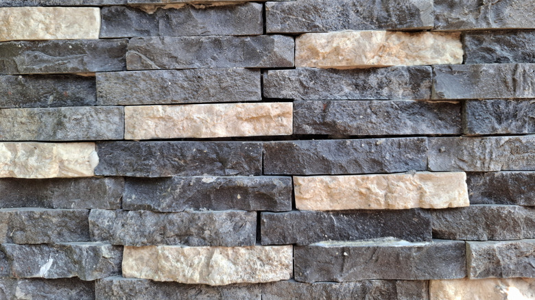 A wall made of stacked andesite stones