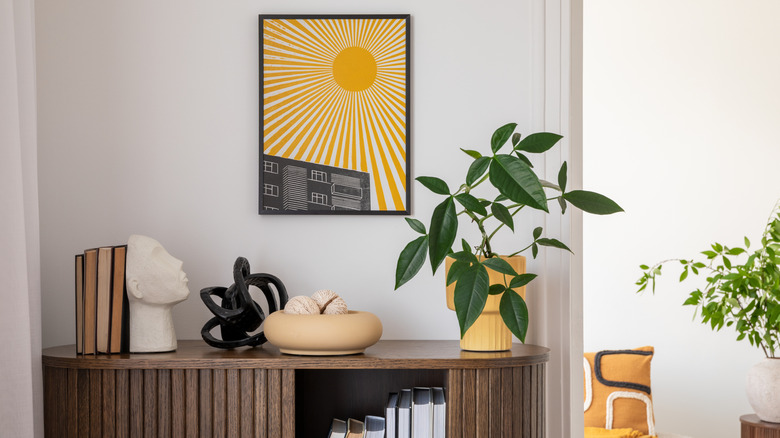 Modern living room corner with eclectic decor and various yellow trinkets