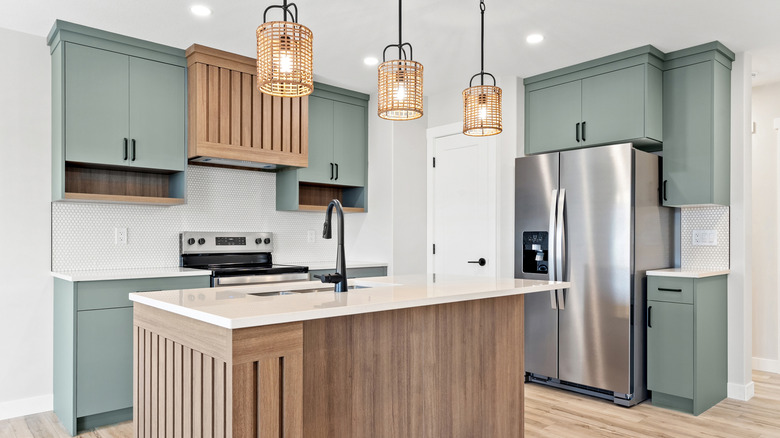 A wide view of a spotlessly clean, modern kitchen.