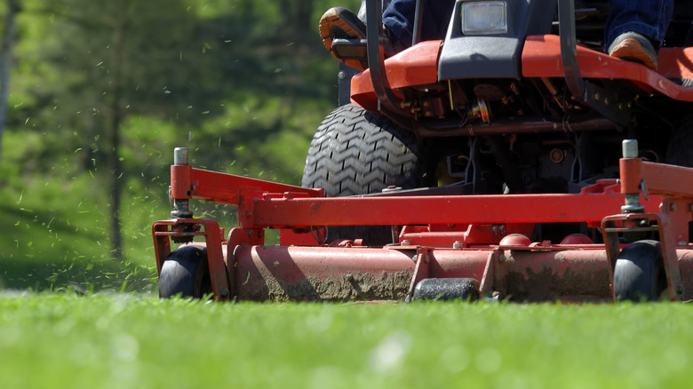 A red riding mower
