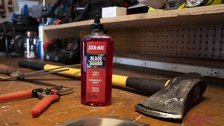 Bottle of STA-BIL blade oil on a workbench