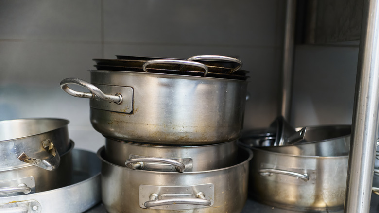 Steel pans being stacked on top of each other