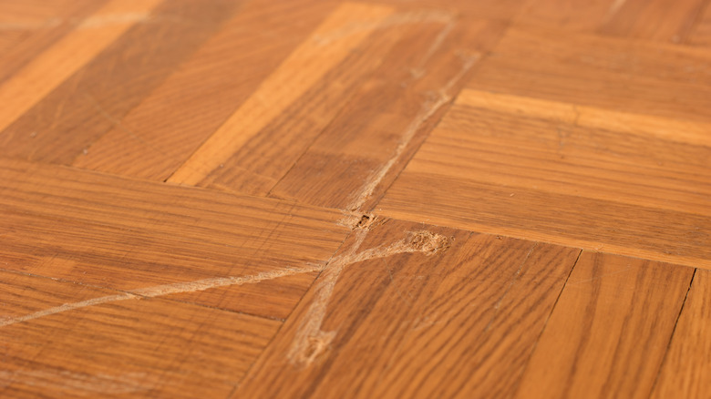 Deep scratch on wood floor