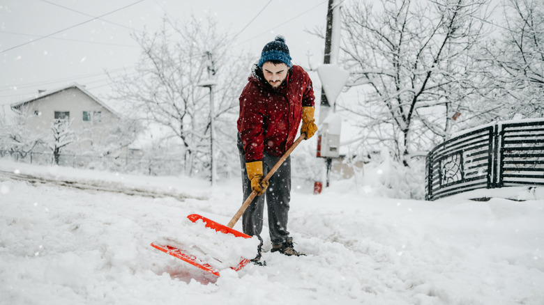 Man shoveling his driveway