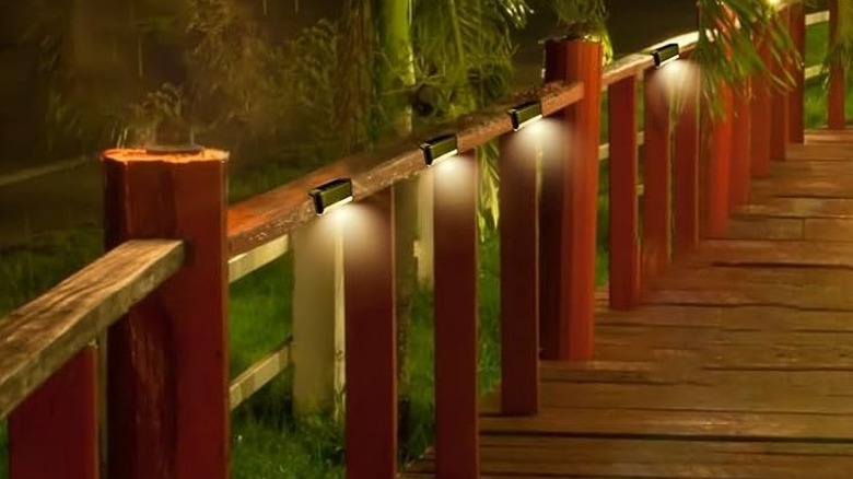 Solar lights installed on a deck railing