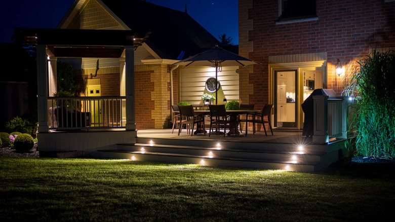 Deck lights illuminated along steps at night