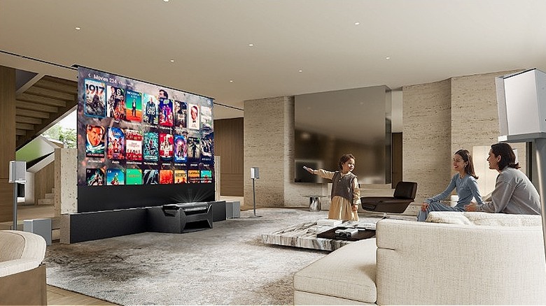 Family using AWOL projector to choose a movie in their living room