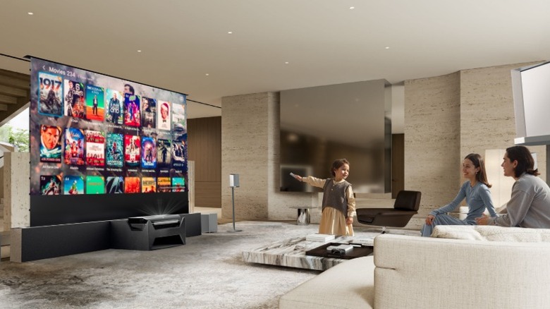 Family using AWOL projector to choose a movie in their living room