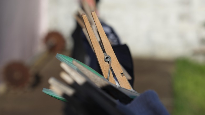wooden pegs holding fabric