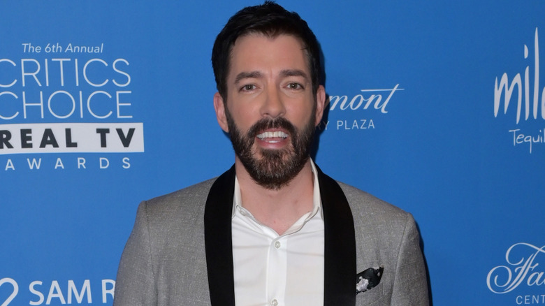 Drew Scott in grey suit