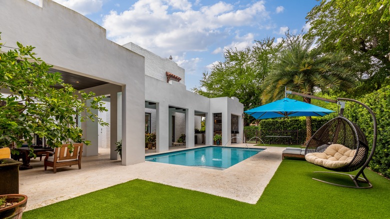 Tropical backyard with artificial grass