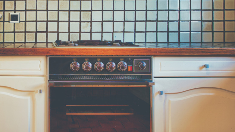 Dated kitchen with tile counters