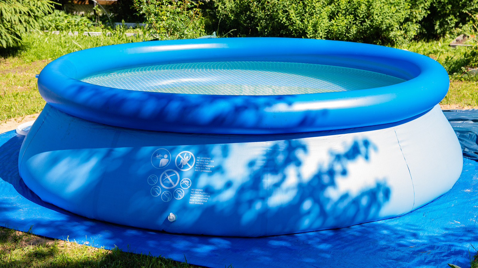 Protect Your Grass By Placing These Items Underneath Your Inflatable Pool