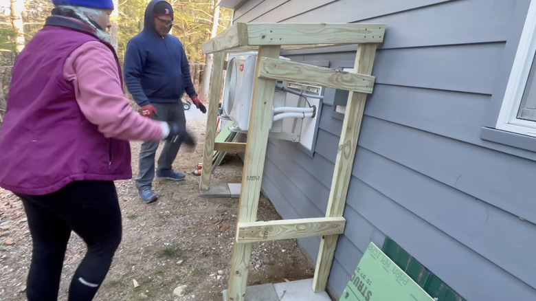 The frame of a heat pump cover that's ready for the roof to be added