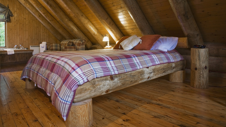 Wood bed in darker wood loft style room