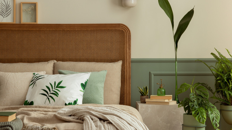 Rattan and wood headboard with neutral bedding