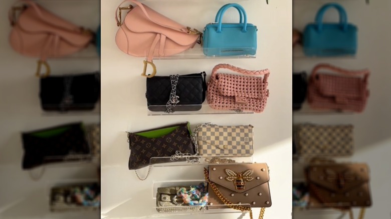 Purse wall made with multiple acrylic shelves, each holding 2 purses