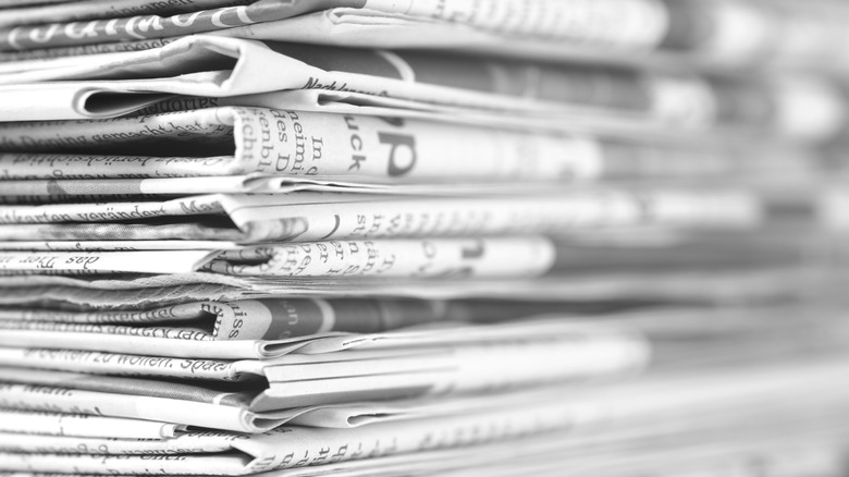 Closeup shot of a stack of newspapers folded on top of each other.