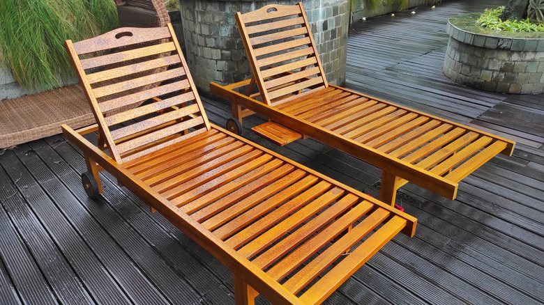 Two teak lounge chairs