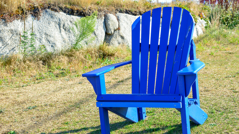 A plastic adirondack chair on a lawn