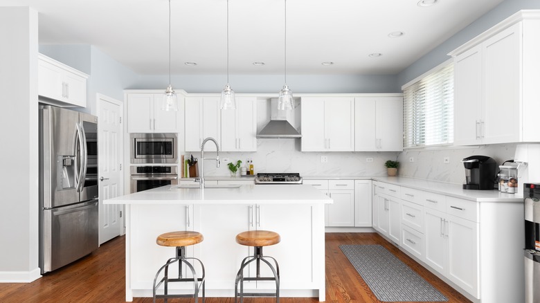 White kitchen with above cabinet storage