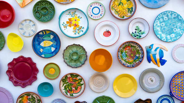 An array of decorative dishes spread out on a table.