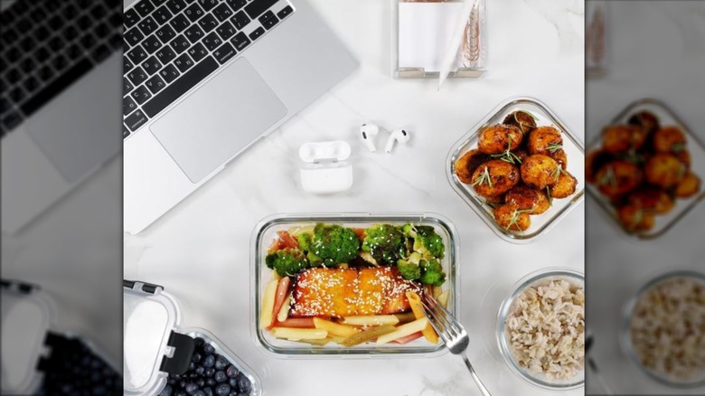 Magic Mill food storage containers with meal on desk
