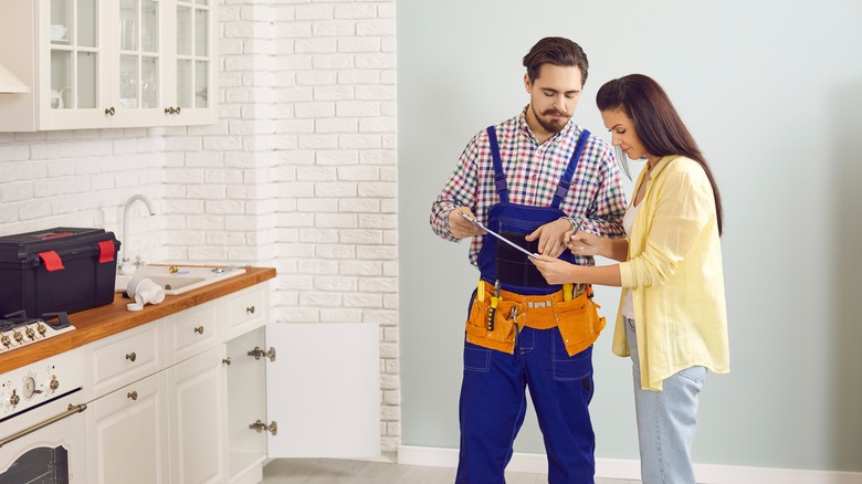 plumber going over estimate with client