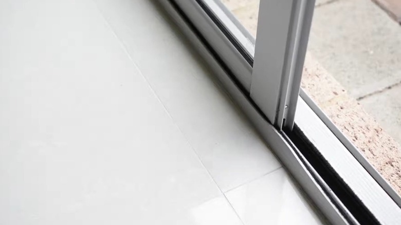 closeup on warped sliding door track