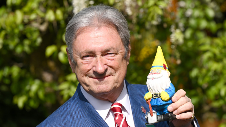 Alan Titchmarsh holding a garden gnome
