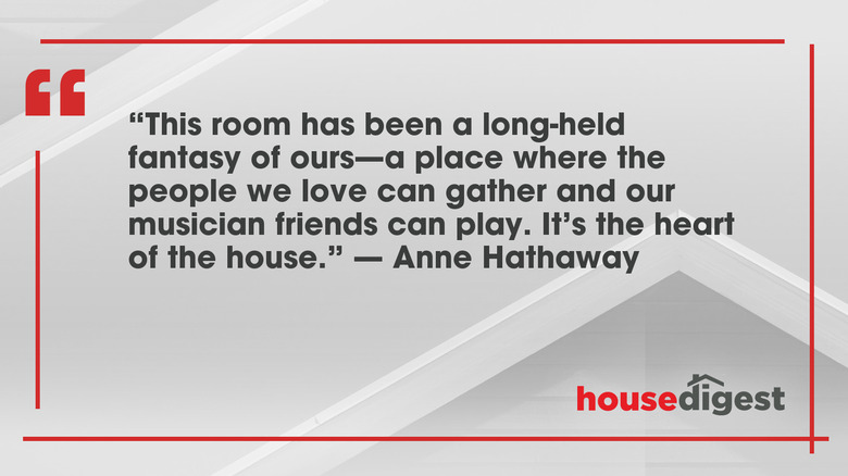 A white graphic with Anne Hathaway's quote about "...the heart of the home" in black text and the House Digest logo..