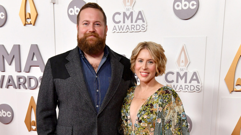 Ben and Erin Napier smiling on a red carpet