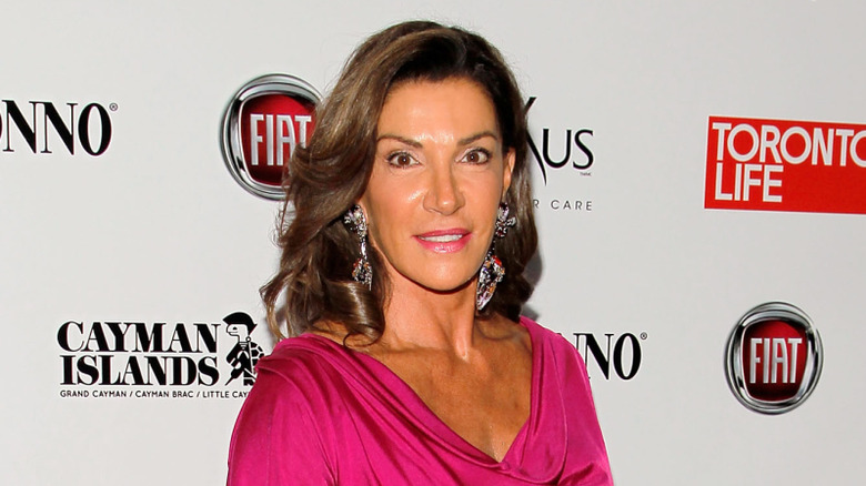 Hilary Farr in a pink dress at a red carpet event