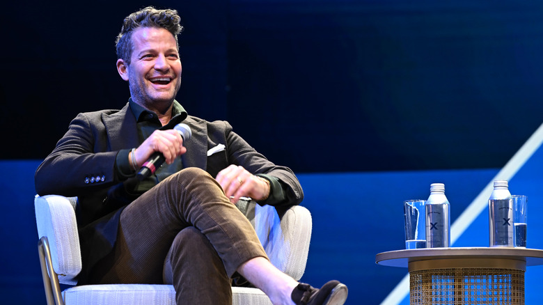 Nate Berkus laughing while speaking at an event
