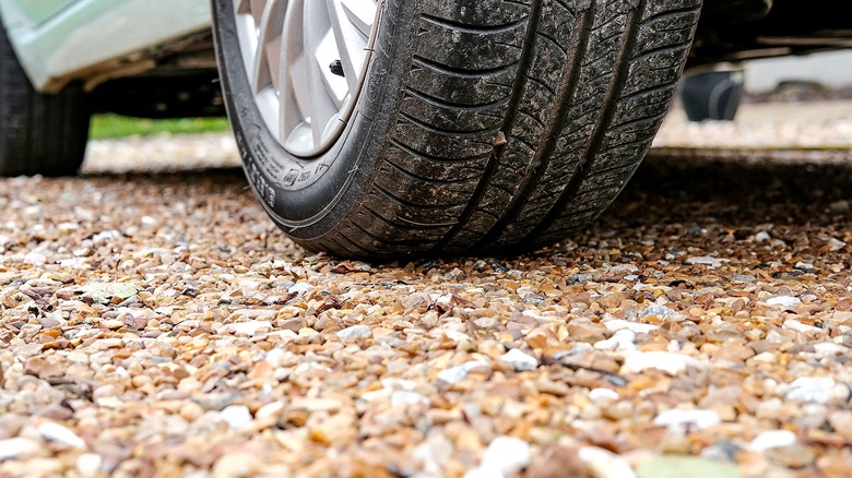 Close-up view of a towel and a gravel driveway