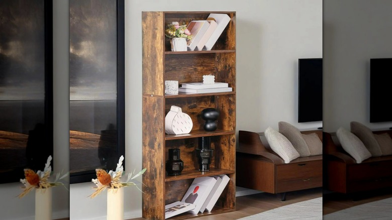 A sturdy brown bookshelf near a window